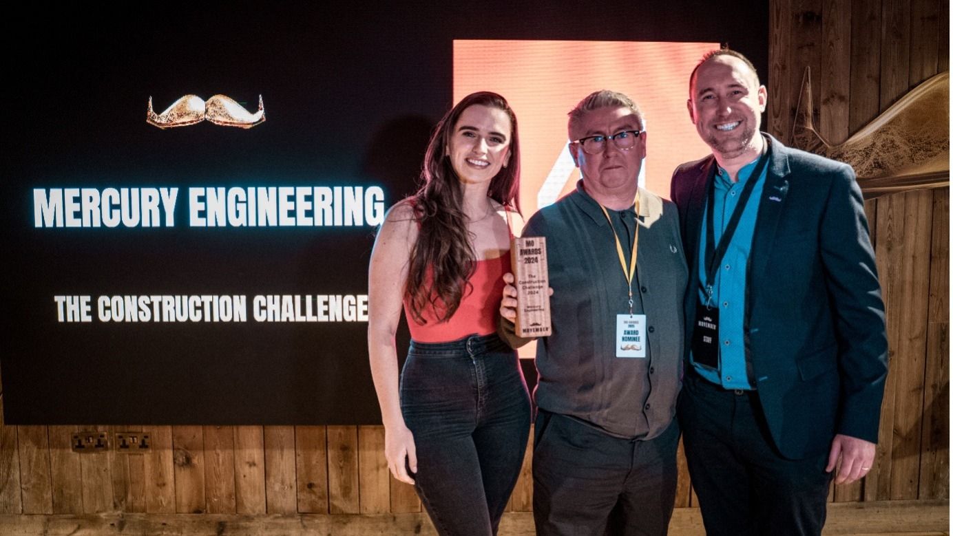Mercury engineering posing at the mo awards accepting their trophy