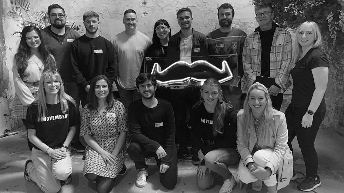 Workplace movember ambassadors posing for a group photo