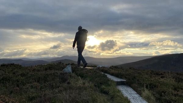 James hiking through Irish countryside