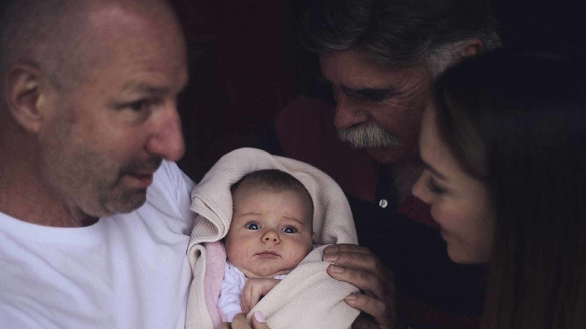 Photo of a family standing together.