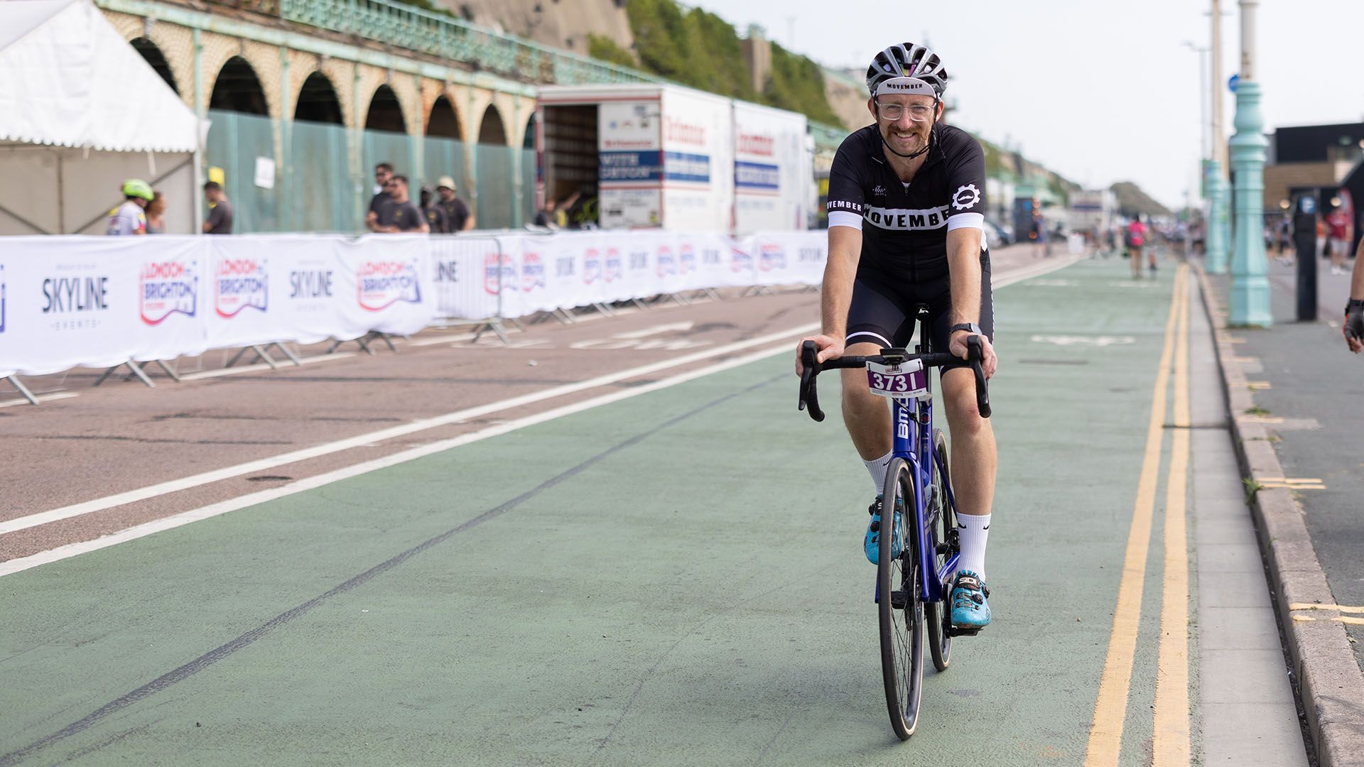 Photo of cyclist at a race near the coast.