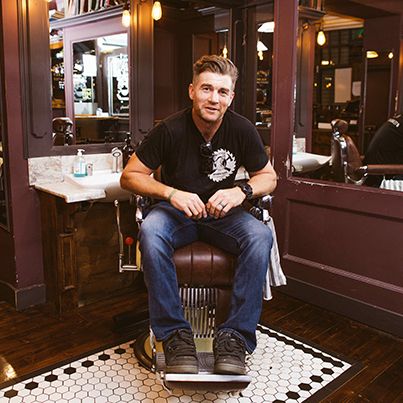 Photo of Movember supporter Kevin Sharkey in a barber chair.