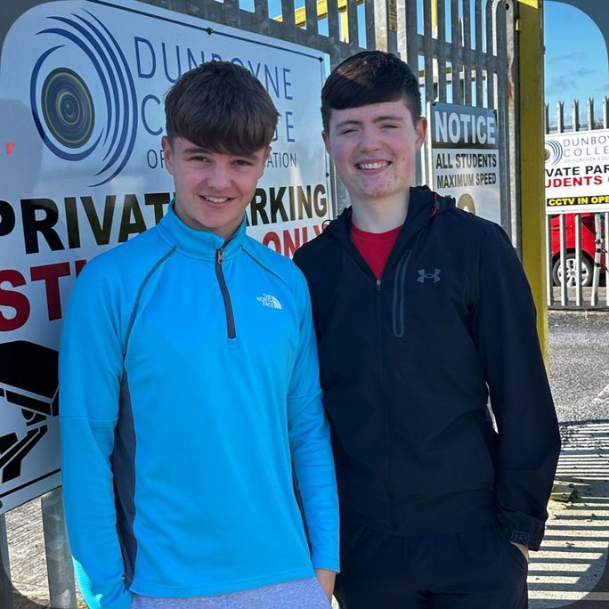 Photo of two boys smiling to camera.